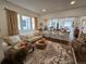 Comfortable living room with hardwood floors and an open layout to the kitchen at 2725 N Gaylord St, Denver, CO 80205