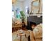 Charming living room with a fireplace and natural light from the windows at 2725 N Gaylord St, Denver, CO 80205