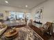 Bright living room showcasing hardwood floors and an open layout to the kitchen at 2725 N Gaylord St, Denver, CO 80205