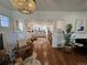 Open-concept living room with hardwood floors and views into the kitchen at 2725 N Gaylord St, Denver, CO 80205
