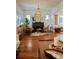Cozy living room with a fireplace, hardwood floors, and a decorative mirror at 2725 N Gaylord St, Denver, CO 80205