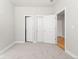An empty room showcases multiple closets and neutral tones, ideal for flexible use at 2828 N Federal Blvd, Denver, CO 80211