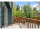 Inviting back deck area with wood railings and lush greenery at 6183 Xavier St, Arvada, CO 80003