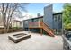 Large backyard area featuring a wooden deck, firepit, and grill, perfect for entertaining at 6183 Xavier St, Arvada, CO 80003