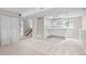 Finished basement with stairs, bar area, and neutral colors at 6183 Xavier St, Arvada, CO 80003