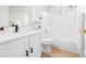 Pristine bathroom with sleek white vanity, modern fixtures, and a combined bathtub and shower at 6183 Xavier St, Arvada, CO 80003