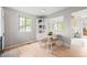 Charming dining area with a view, featuring a light wood table and built in shelving at 6183 Xavier St, Arvada, CO 80003