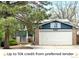 Charming two-story home with a brick facade and an attached two-car garage and solar panels at 6183 Xavier St, Arvada, CO 80003