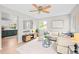 Cozy living room with modern decor, plush seating, and an open view into the dining area at 6183 Xavier St, Arvada, CO 80003