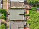 A top-down aerial view reveals the layout of a home and its adjacent outdoor spaces and neighboring buildings at 1024 34Th St, Denver, CO 80205