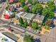 An aerial view of a tree-lined street shows homes and parked cars, capturing the neighborhood's charm at 1024 34Th St, Denver, CO 80205