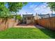 Backyard with brick patio, small lawn, and privacy fence; ideal for entertaining at 1024 34Th St, Denver, CO 80205