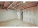 Spacious basement with herringbone tile flooring and open ceilings at 1024 34Th St, Denver, CO 80205