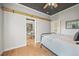 Charming bedroom with hardwood floors, black ceiling, and a view into the dining room at 1024 34Th St, Denver, CO 80205
