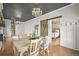 Inviting dining room featuring a chandelier, gray ceiling, and view of the adjacent bedroom at 1024 34Th St, Denver, CO 80205