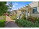Inviting front porch with well-manicured landscaping enhances the curb appeal of this lovely home at 1024 34Th St, Denver, CO 80205