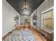 Spacious living room featuring hardwood floors, modern light fixture and ample natural light at 1024 34Th St, Denver, CO 80205