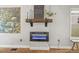 Living room with fireplace, decor, and large windows providing plenty of light at 1024 34Th St, Denver, CO 80205