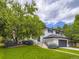 Beautiful two-story home with a lush green lawn and mature trees, offering great curb appeal at 3793 S Sebring Ct, Denver, CO 80237