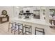 Modern kitchen with stainless steel appliances, a breakfast bar, and lots of cabinet space at 3793 S Sebring Ct, Denver, CO 80237