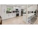 Spacious kitchen with a breakfast bar, stainless steel appliances, and ample cabinet space at 3793 S Sebring Ct, Denver, CO 80237