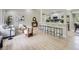 Open-concept living area with stylish furnishings, hardwood floors, and lots of natural light at 3793 S Sebring Ct, Denver, CO 80237