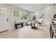 Bright living room with hardwood floors, modern furnishings, and large windows at 3793 S Sebring Ct, Denver, CO 80237