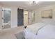Comfortable main bedroom with barn door to ensuite bath; also a separate closet and overhead lighting at 3793 S Sebring Ct, Denver, CO 80237