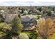 Aerial view of a home with solar panels, large deck and landscaped backyard at 1437 Cassin Ct, Boulder, CO 80303