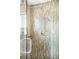 Glass enclosed shower featuring contemporary shower head and hardware and tiled backsplash at 1437 Cassin Ct, Boulder, CO 80303