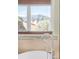 Bathroom featuring a soaking tub and a window view of the nearby mountains at 1437 Cassin Ct, Boulder, CO 80303