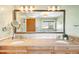 Bathroom featuring a large mirror, double sinks and granite countertops at 1437 Cassin Ct, Boulder, CO 80303