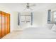 This bedroom features a large window, an overhead fan and a large closet at 1437 Cassin Ct, Boulder, CO 80303