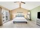 Bright bedroom with a pitched ceiling, plush carpeting, and glass doors leading to a private balcony at 1437 Cassin Ct, Boulder, CO 80303