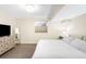 Cozy bedroom with neutral walls, plush carpet, and a large window for plenty of natural light at 1437 Cassin Ct, Boulder, CO 80303