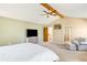 Spacious primary bedroom with vaulted ceilings, ceiling fan, and neutral decor with easy access to the ensuite bathroom at 1437 Cassin Ct, Boulder, CO 80303