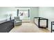 Bright Bedroom featuring neutral colored walls, a crib and a chair at 1437 Cassin Ct, Boulder, CO 80303
