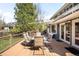 Outdoor deck featuring a table with seating and an outdoor grill and hot tub at 1437 Cassin Ct, Boulder, CO 80303