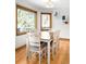 Cozy dining room with hardwood floors, light walls, modern artwork and lots of natural light at 1437 Cassin Ct, Boulder, CO 80303