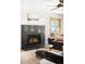 Living room with fireplace, hardwood floors, ceiling fan and modern decor at 1437 Cassin Ct, Boulder, CO 80303