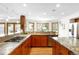 Well-lit kitchen with stainless appliances, granite counter tops and hardwood flooring at 1437 Cassin Ct, Boulder, CO 80303