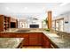 Gourmet kitchen features granite countertops, stainless steel appliances and custom wood cabinetry at 1437 Cassin Ct, Boulder, CO 80303