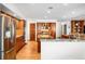 Spacious kitchen with stainless steel appliances, granite counters, wood cabinets, and hardwood floors at 1437 Cassin Ct, Boulder, CO 80303