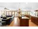 Open kitchen and living area featuring wood floors, stainless appliances and access to outdoor deck at 1437 Cassin Ct, Boulder, CO 80303