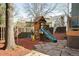 Charming backyard playground with a slide and swing set for Gathering fun, surrounded by lush landscaping at 1437 Cassin Ct, Boulder, CO 80303