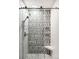Sleek walk-in shower features mosaic tile, glass doors, and bench seating at 1437 Cassin Ct, Boulder, CO 80303
