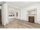 Inviting living room with fireplace, open layout, and hardwood floors at 2705 - 2707 N Lafayette St, Denver, CO 80205