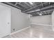 Partially finished basement area with neutral walls and flooring ready for your personalization at 18434 E Belleview Ln, Centennial, CO 80015