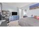 Spacious bedroom featuring plush carpeted floors, a blue dresser, and ample room for relaxation and personalization at 18434 E Belleview Ln, Centennial, CO 80015