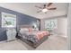 Bright primary bedroom with a ceiling fan and updated furniture at 18434 E Belleview Ln, Centennial, CO 80015